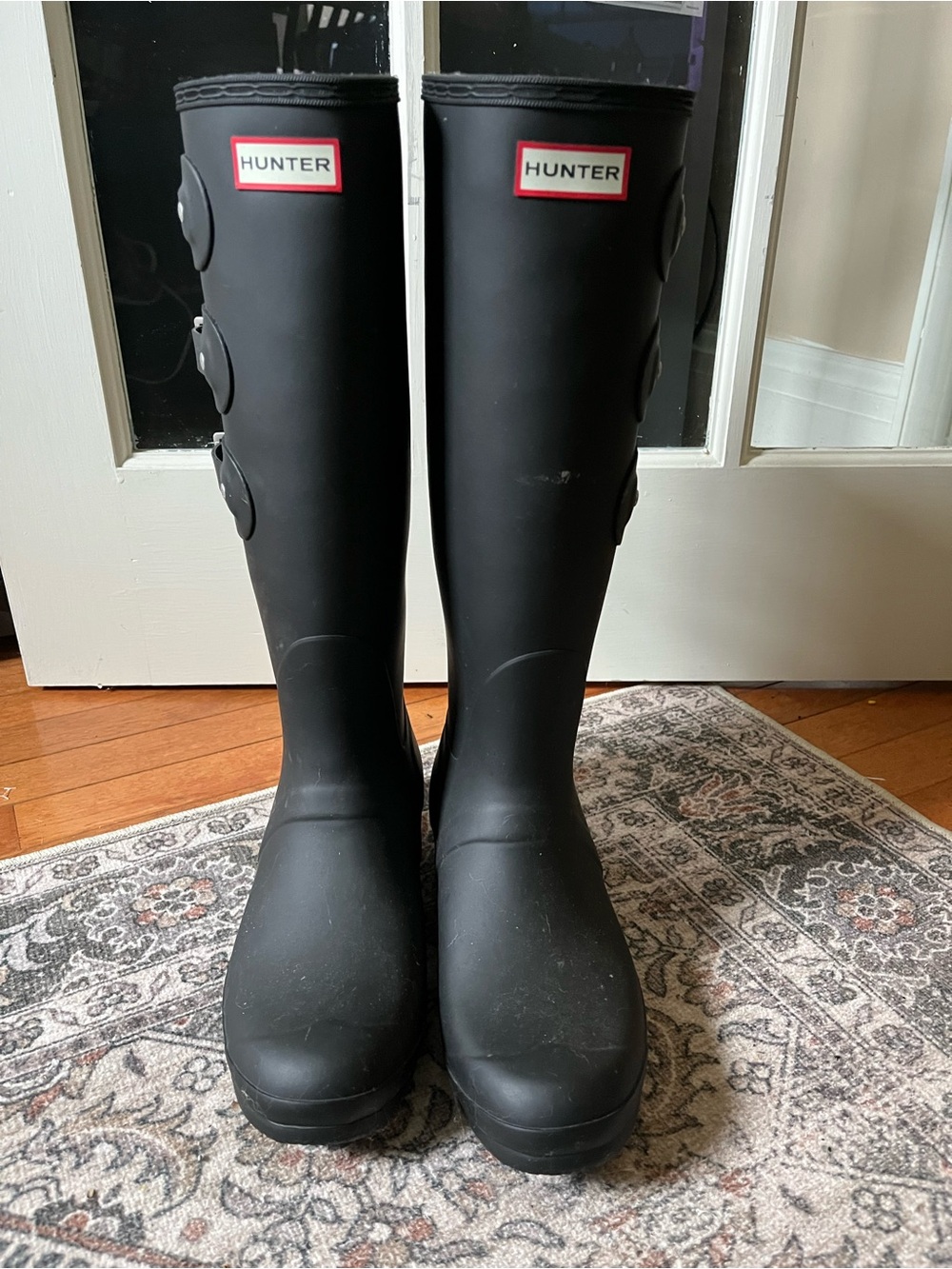 Tall Hunter black boots with side buckles